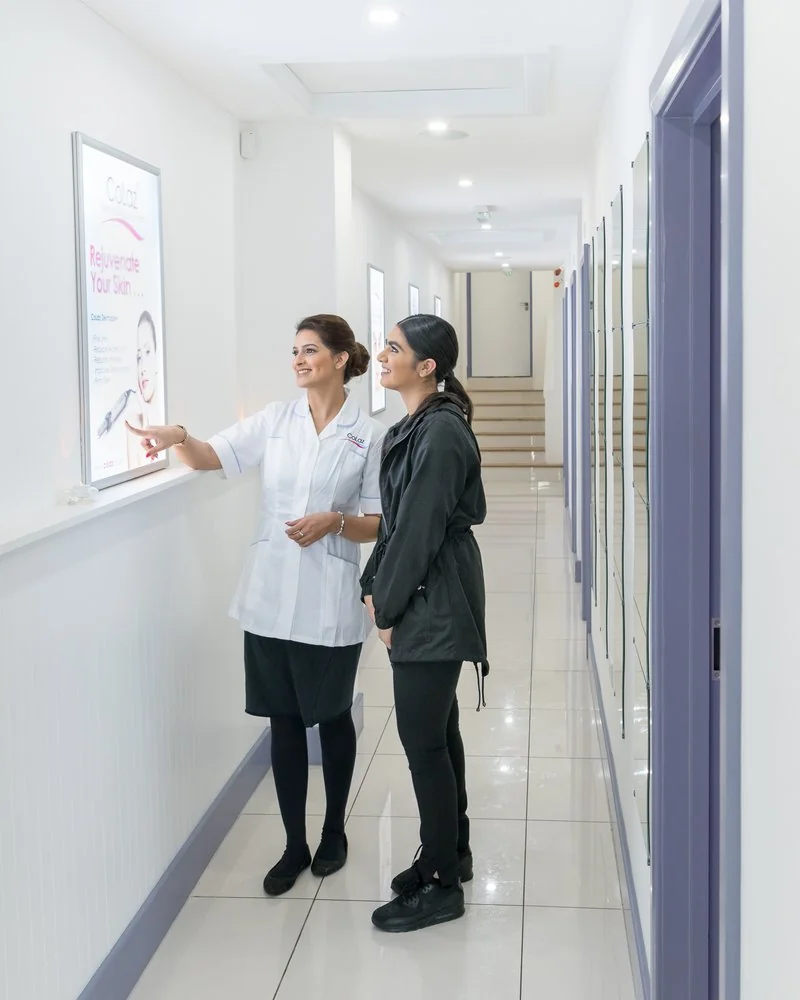 Alayika Parvez points out a treatment programme to a CoLaz patient at the Wembley clinic, photographed in 2018