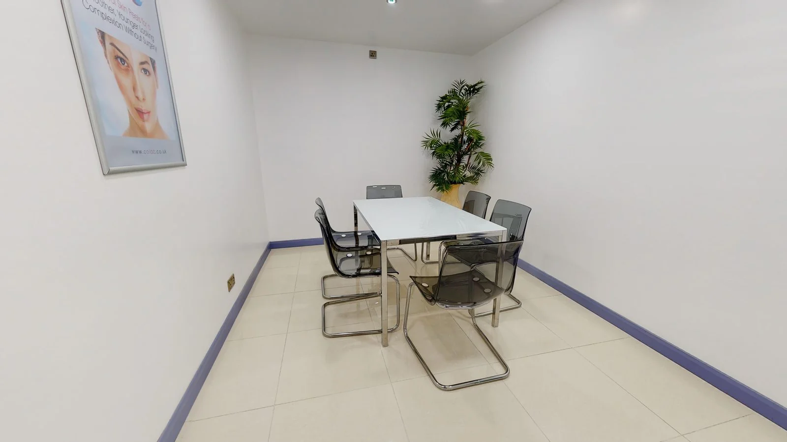 Private consultation room at the CoLaz Derby clinic with a clean glass table and clear chairs ready for the free fifteen-minute consultation