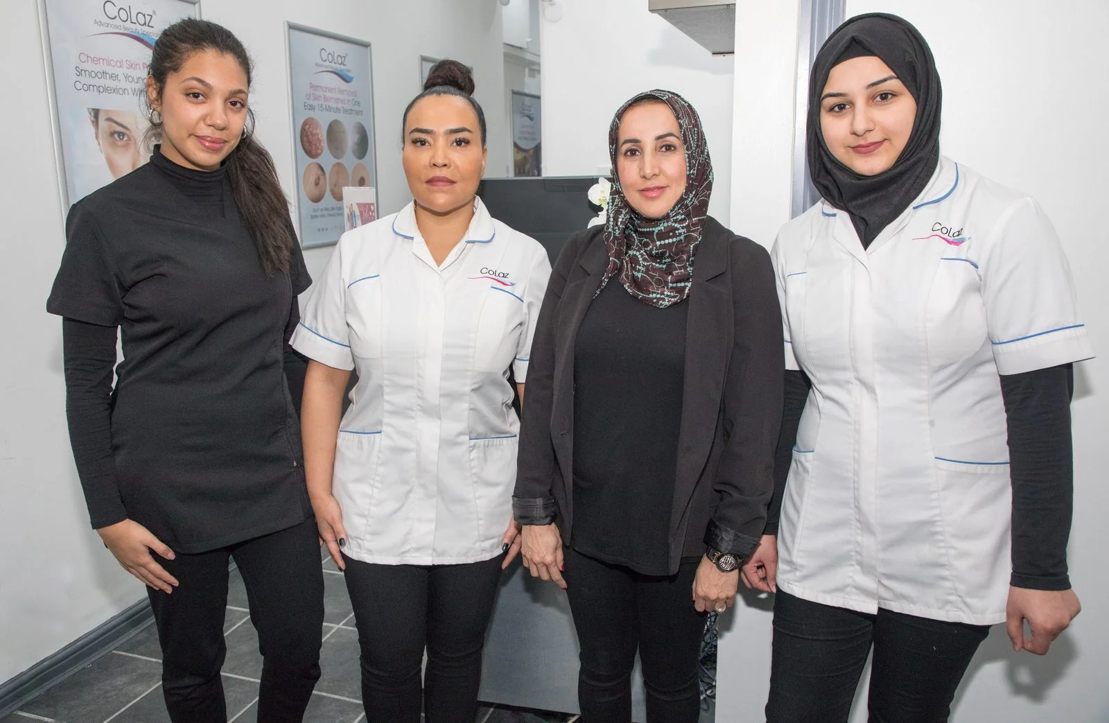 Four qualified clinicians of the CoLaz London Paddington team standing in front of the consultation area