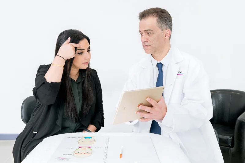 CoLaz clinician reviewing an anti-wrinkle treatment plan with a patient in the consultation room