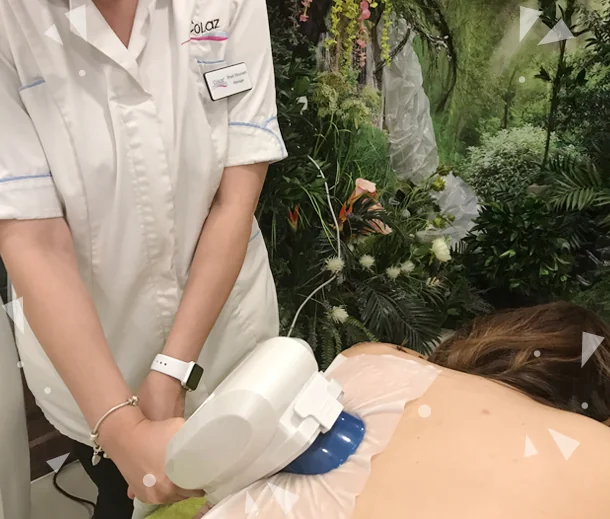 CoLaz clinician applying a fat freeze cooling applicator to a patient's love handle area
